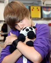 Süßer Junge mit Panda