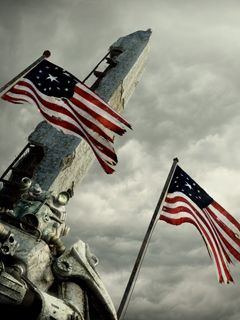 Amerikanische Flaggen und Denkmal