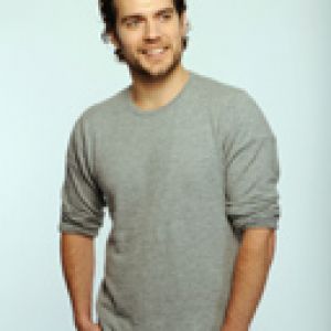 Stylischer Mann im Grauen Pullover